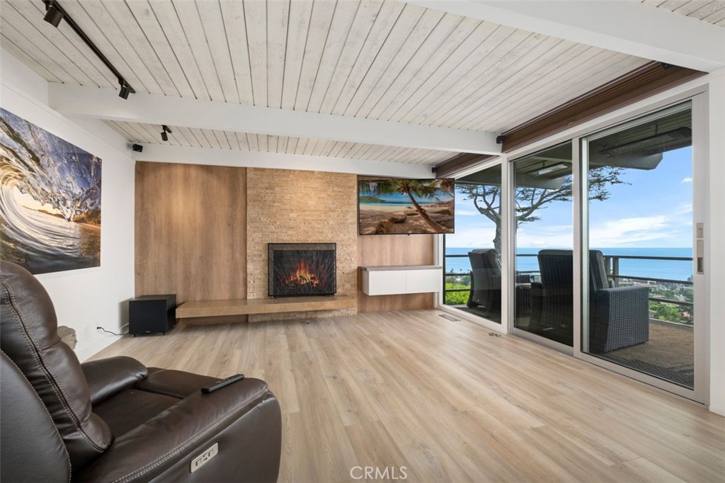 945 Coast View Drive Laguna Beach, CA 92651 - Photo 16 of 40 a view of livingroom with furniture and a fireplace