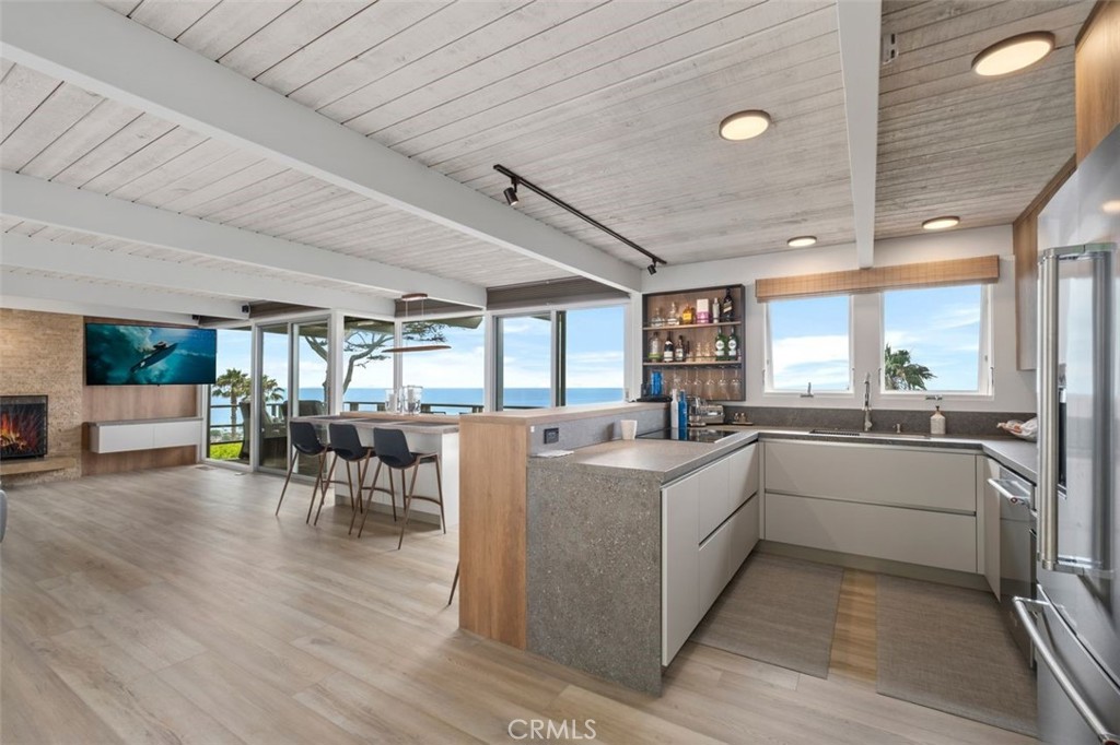 945 Coast View Drive Laguna Beach, CA 92651 - Photo 22 of 40 a kitchen with furniture and window
