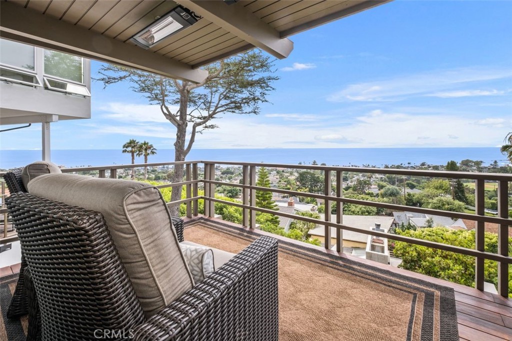 945 Coast View Drive Laguna Beach, CA 92651 - Photo 33 of 40 a view of a balcony with an outdoor seating