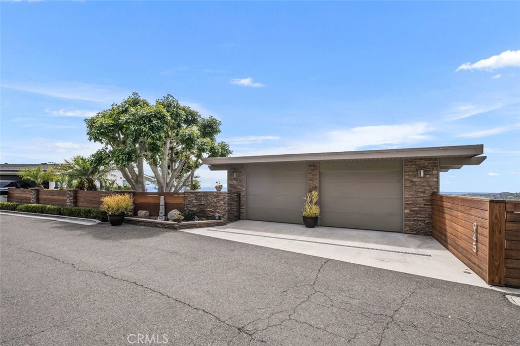 945 Coast View Drive Laguna Beach, CA 92651 - Photo 5 of 40 a view of a car parked in garage