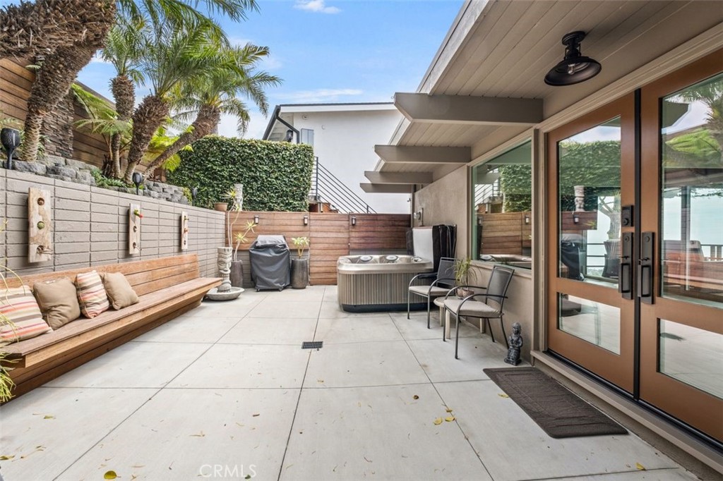 945 Coast View Drive Laguna Beach, CA 92651 - Photo 7 of 40 a balcony with furniture and a potted plant