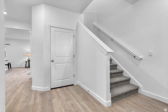 722 West 2840 South, Unit 8 Logan, UT 84321 - Photo 7 of 23 Staircase featuring wood finished floors