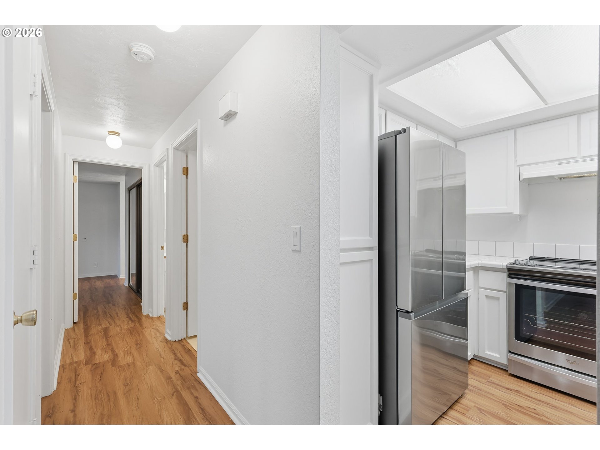 2001 Lake Isle Terrace Eugene, OR 97401 - Photo 12 of 36 a open kitchen with cabinets and stainless steel appliances