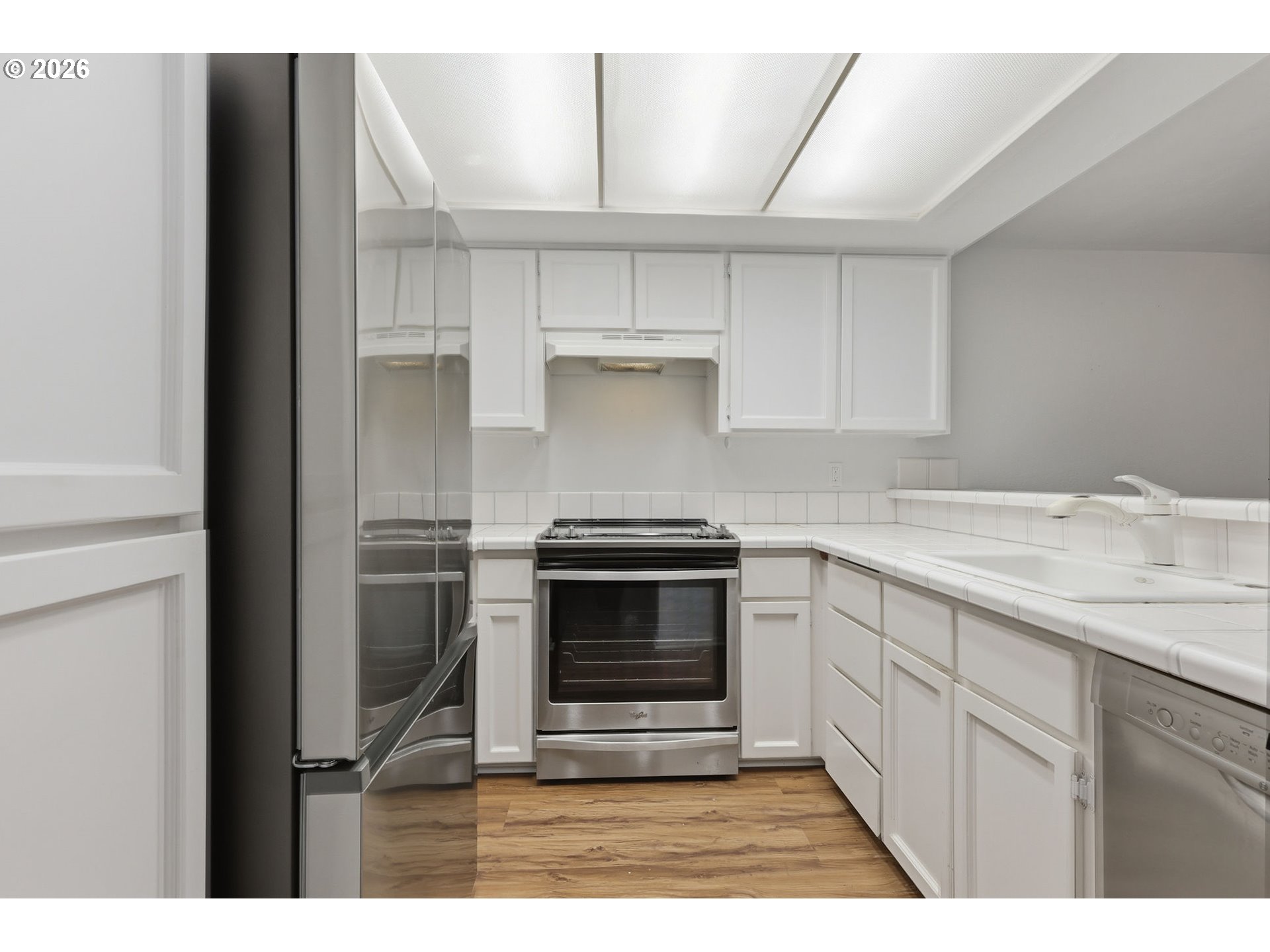 2001 Lake Isle Terrace Eugene, OR 97401 - Photo 13 of 36 a kitchen with granite countertop a stove and a sink