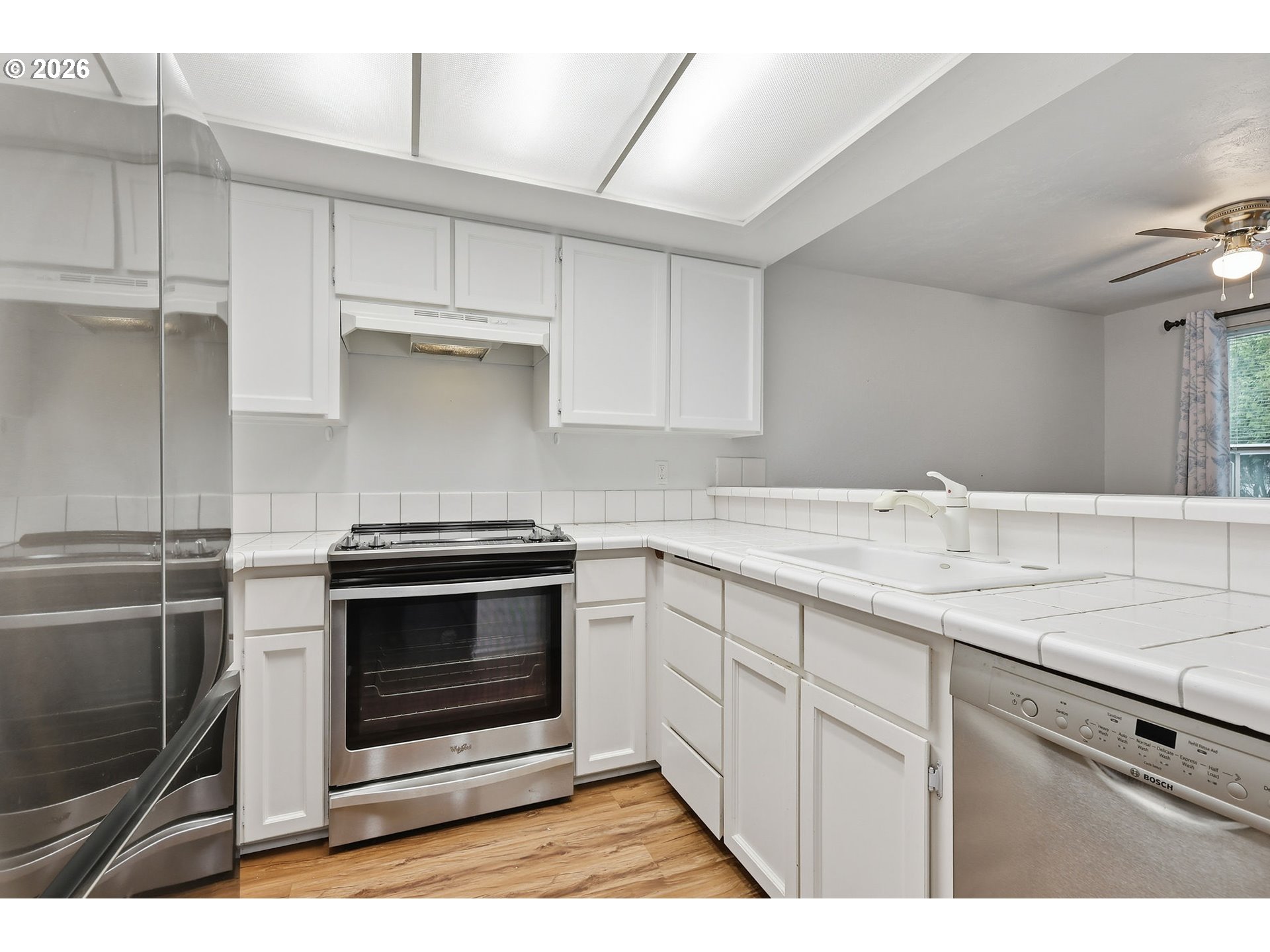 2001 Lake Isle Terrace Eugene, OR 97401 - Photo 14 of 36 a kitchen with cabinets stainless steel appliances and sink