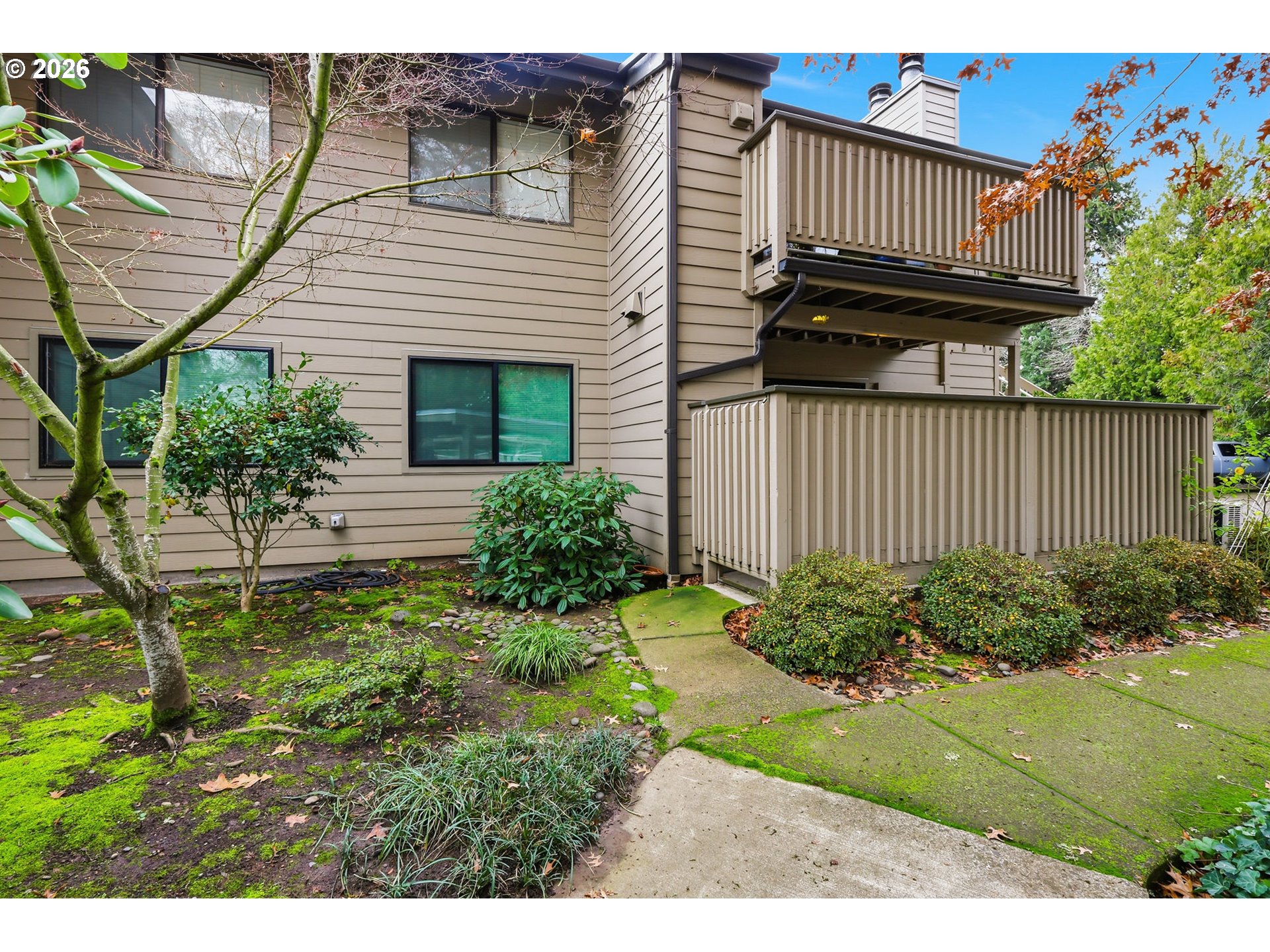 2001 Lake Isle Terrace Eugene, OR 97401 - Photo 4 of 36 a view of backyard with potted plants and a wooden bench