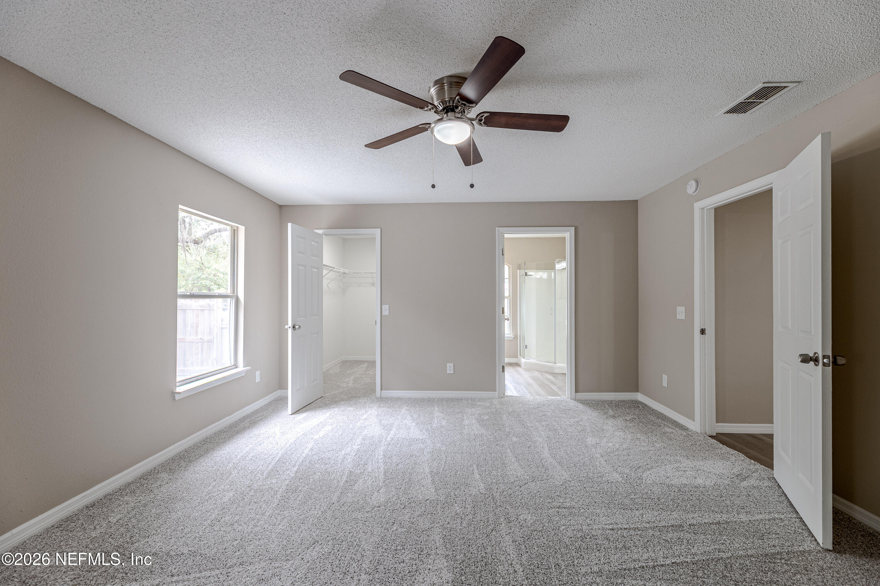 67104 Elnora Lane Yulee, FL 32097 - Photo 19 of 39 a view of an empty room with a window