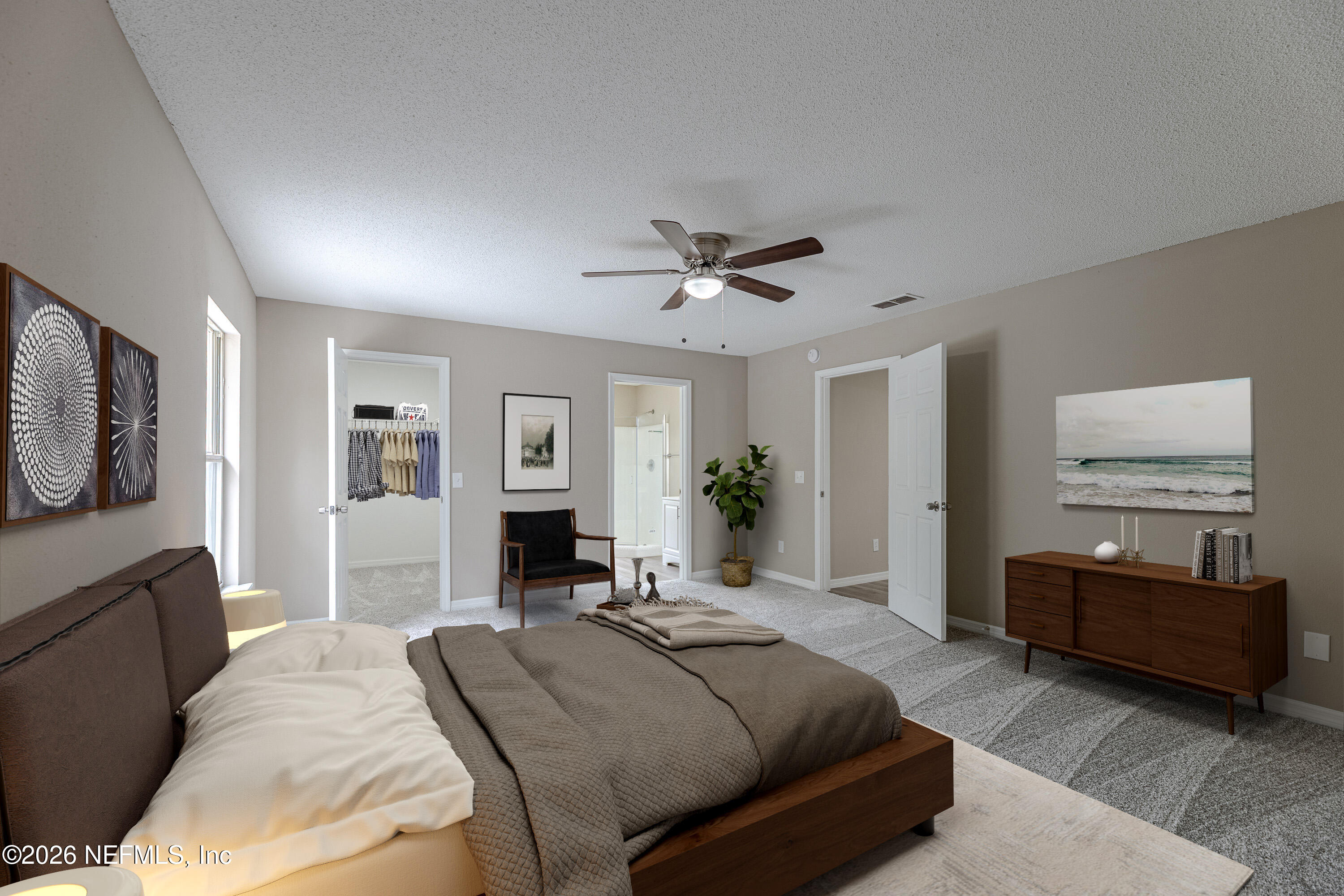 67104 Elnora Lane Yulee, FL 32097 - Photo 20 of 39 a spacious bedroom with a bed and ceiling fan