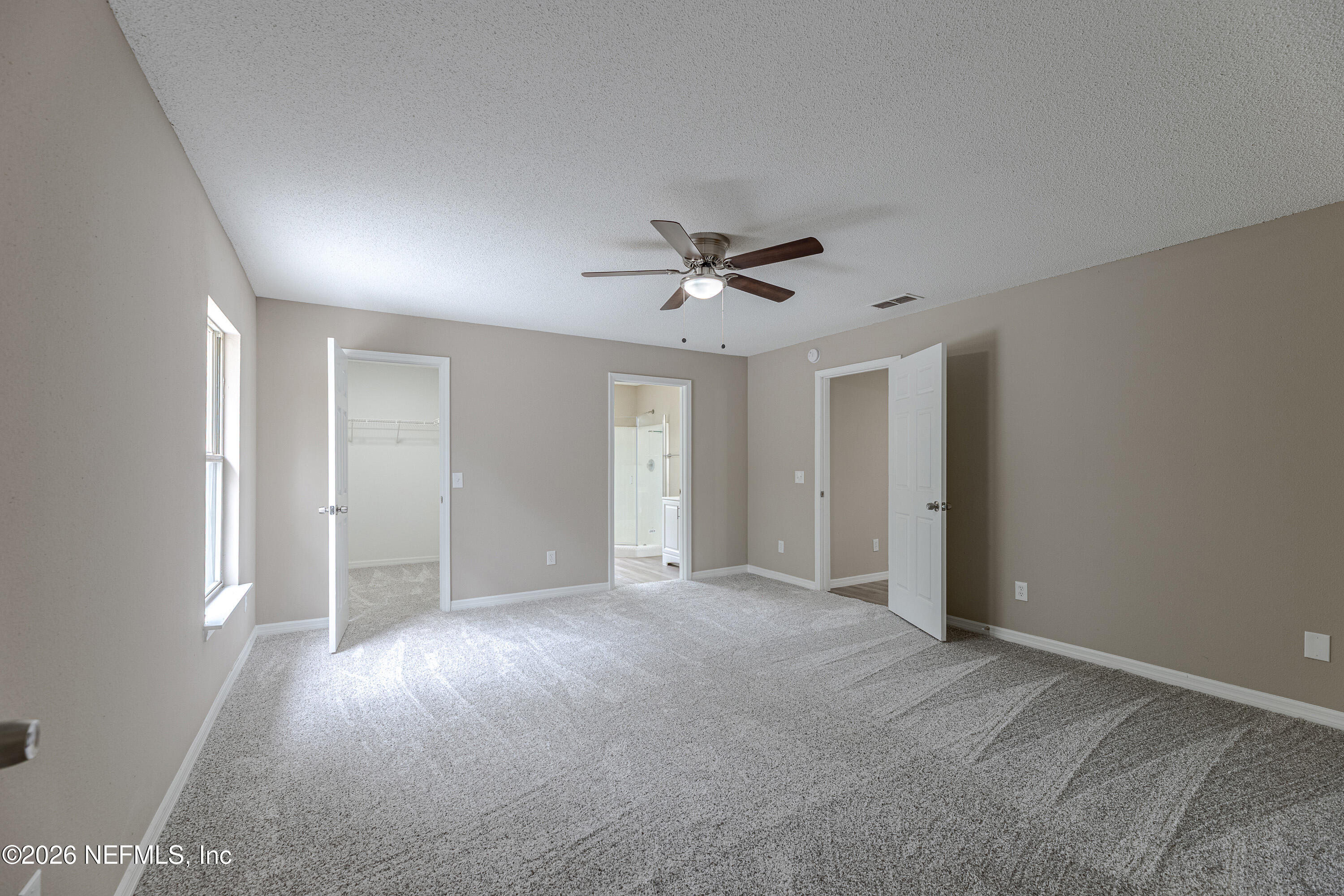 67104 Elnora Lane Yulee, FL 32097 - Photo 21 of 39 a view of a livingroom with a ceiling fan