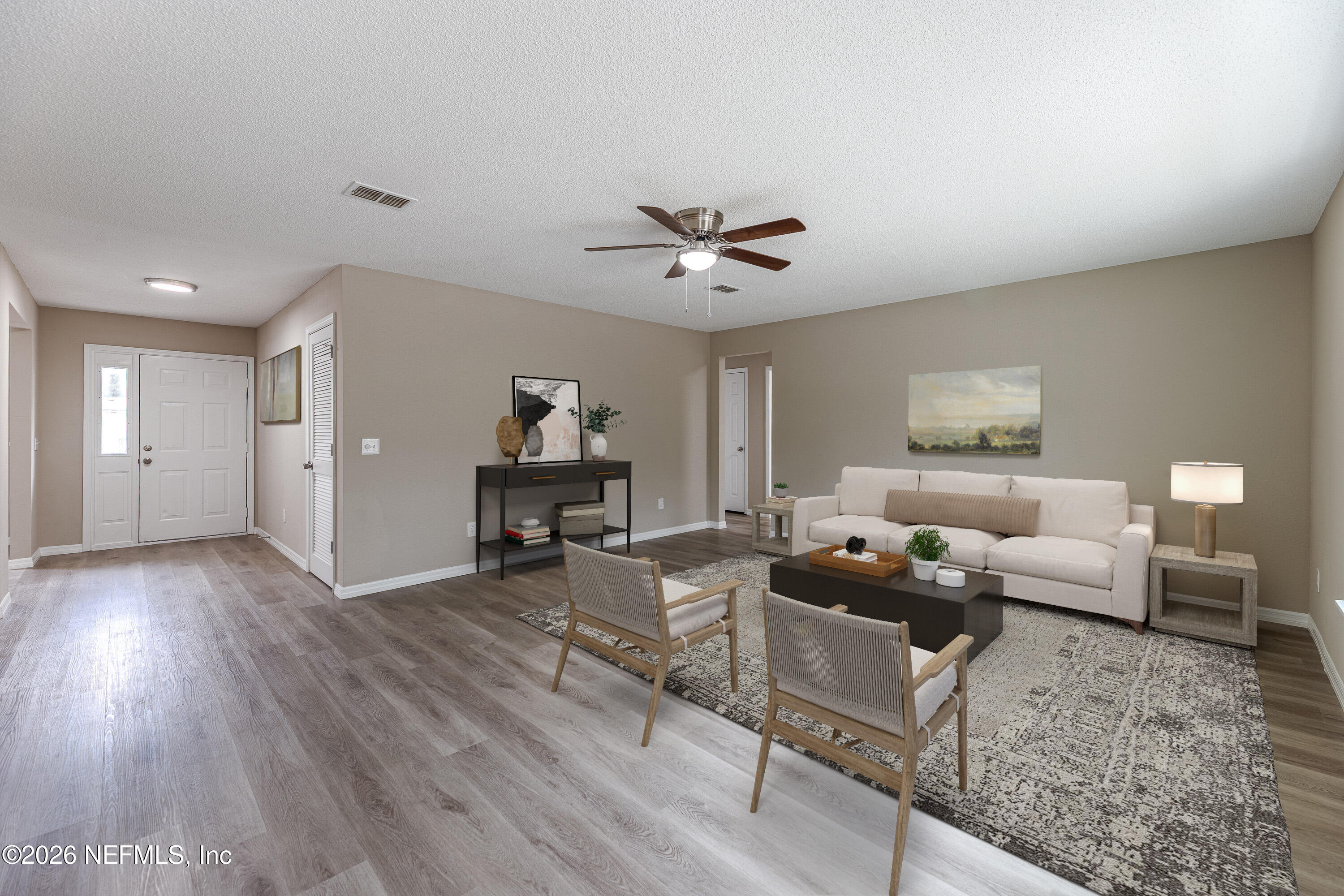 67104 Elnora Lane Yulee, FL 32097 - Photo 26 of 39 a living room with furniture and wooden floor