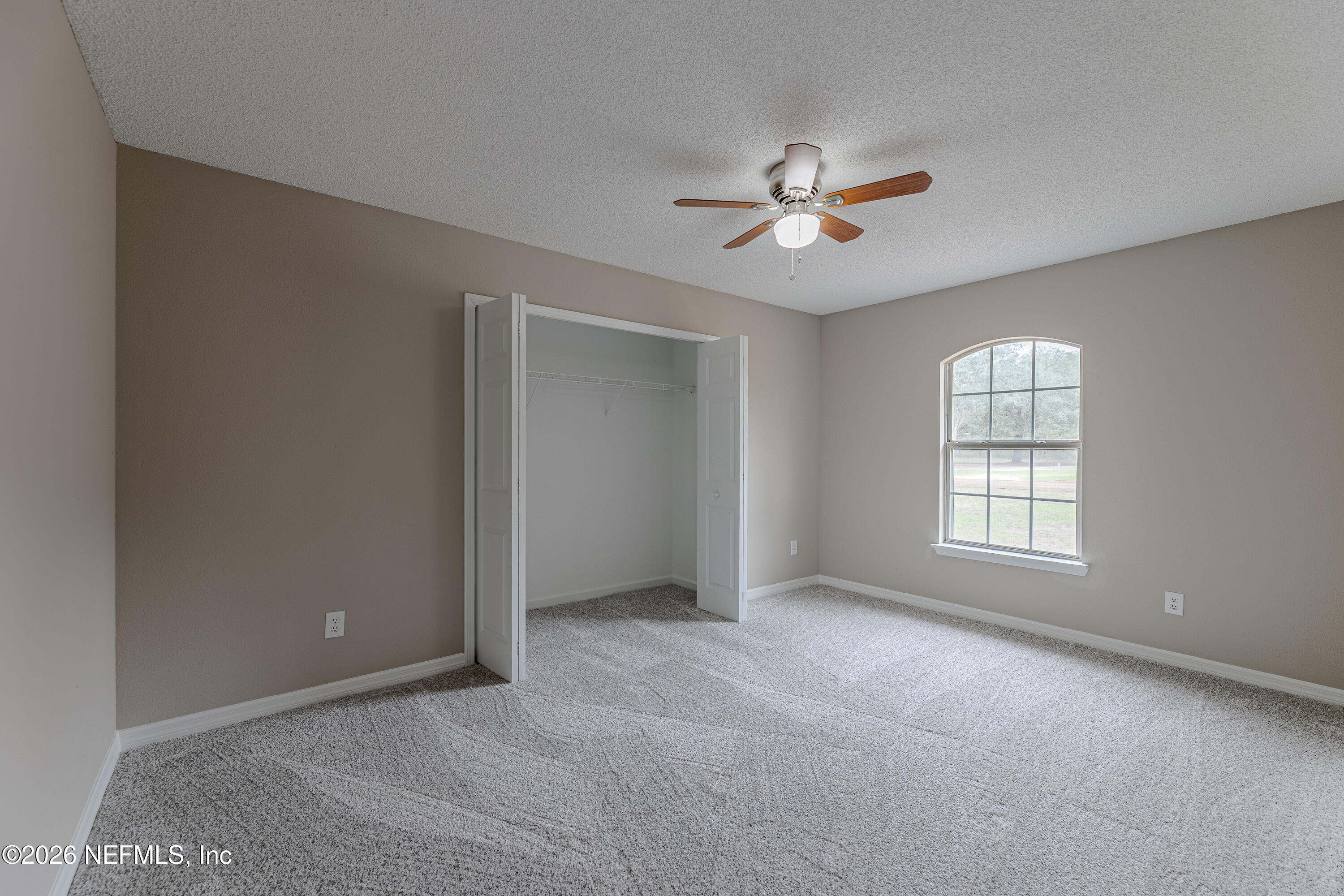 67104 Elnora Lane Yulee, FL 32097 - Photo 30 of 39 a view of an empty room with a window