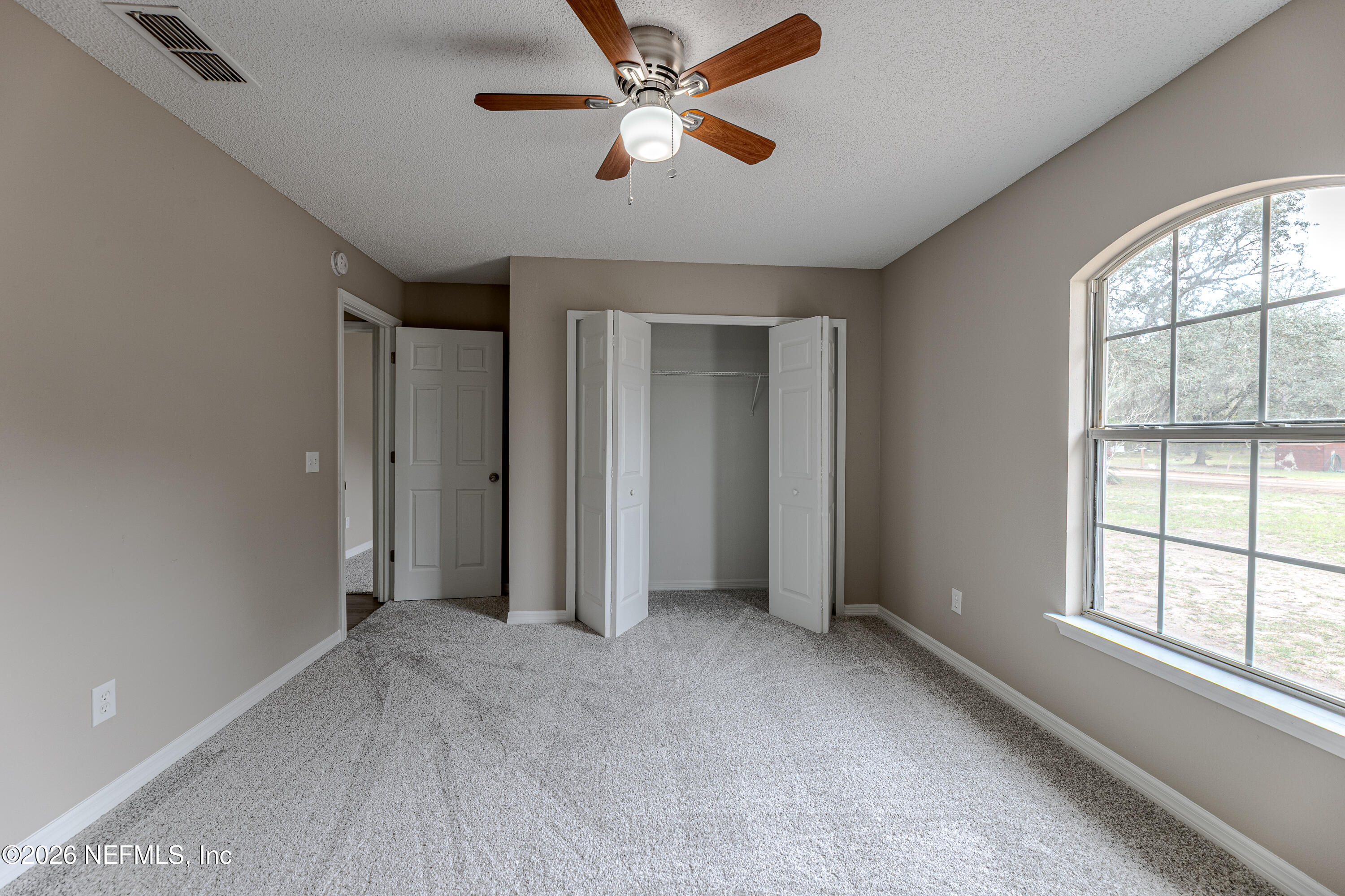 67104 Elnora Lane Yulee, FL 32097 - Photo 33 of 39 a view of an empty room with a window