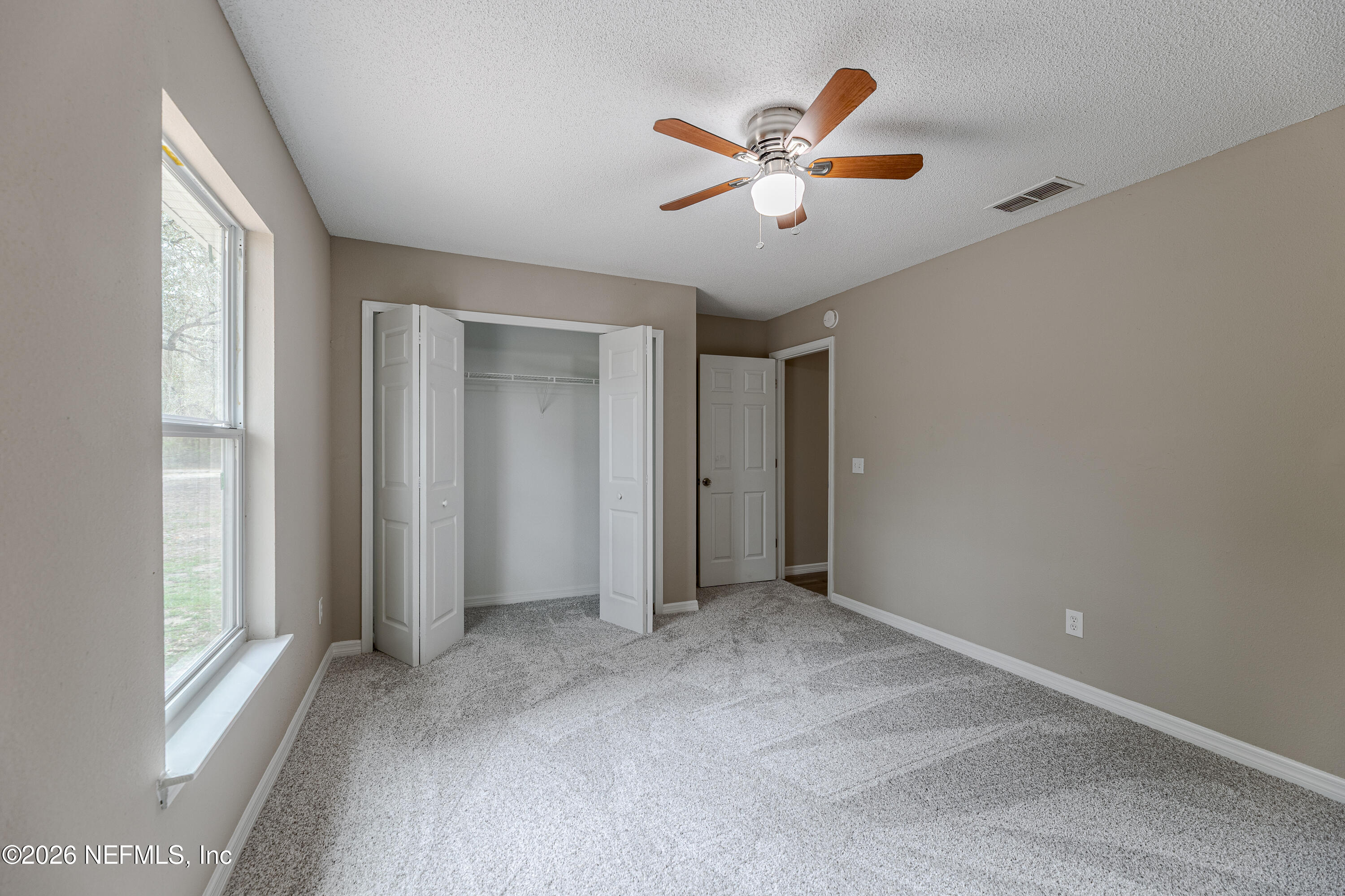 67104 Elnora Lane Yulee, FL 32097 - Photo 39 of 39 a view of an empty room with window