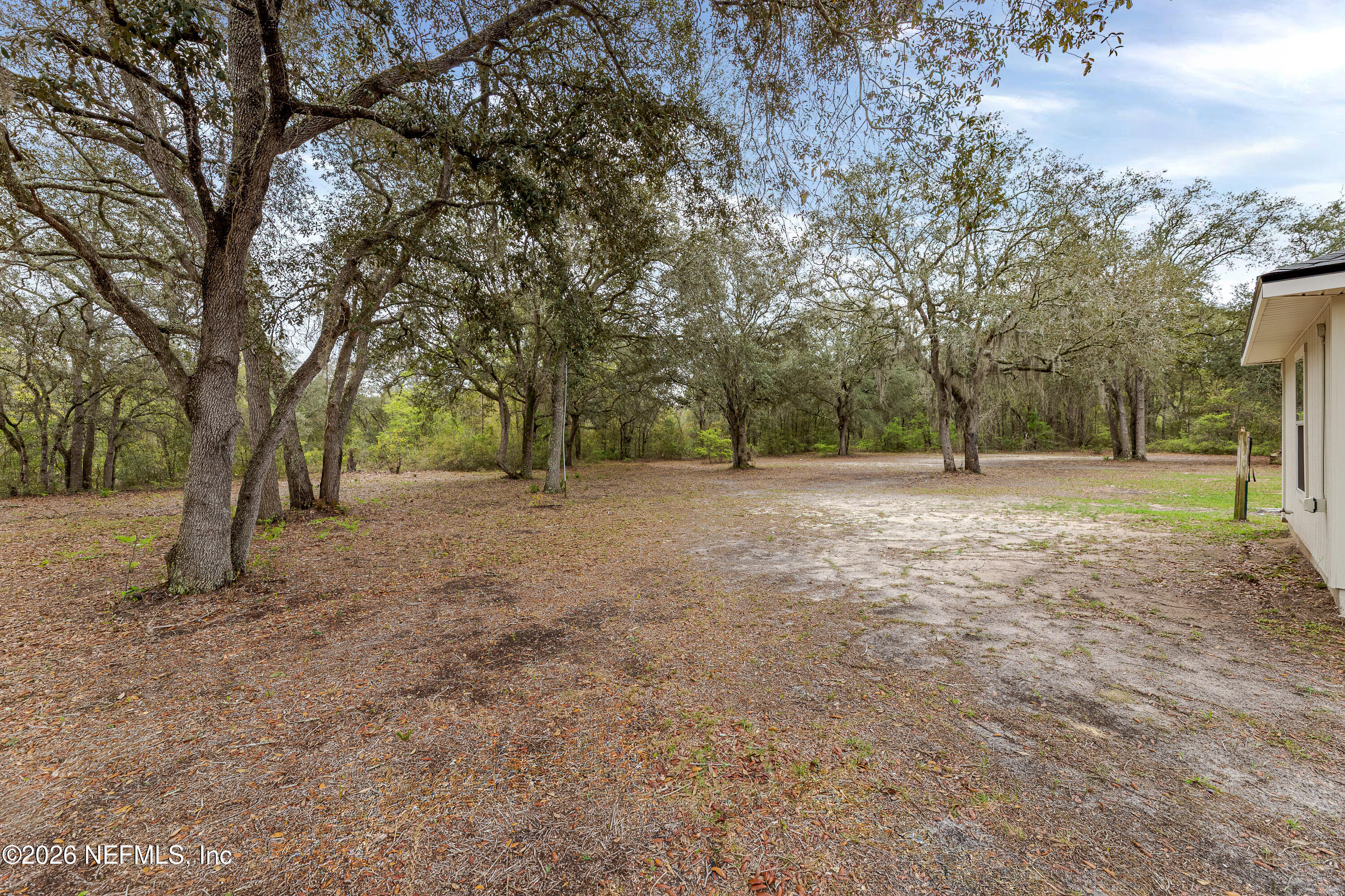 67104 Elnora Lane Yulee, FL 32097 - Photo 5 of 39 a view of outdoor space with trees