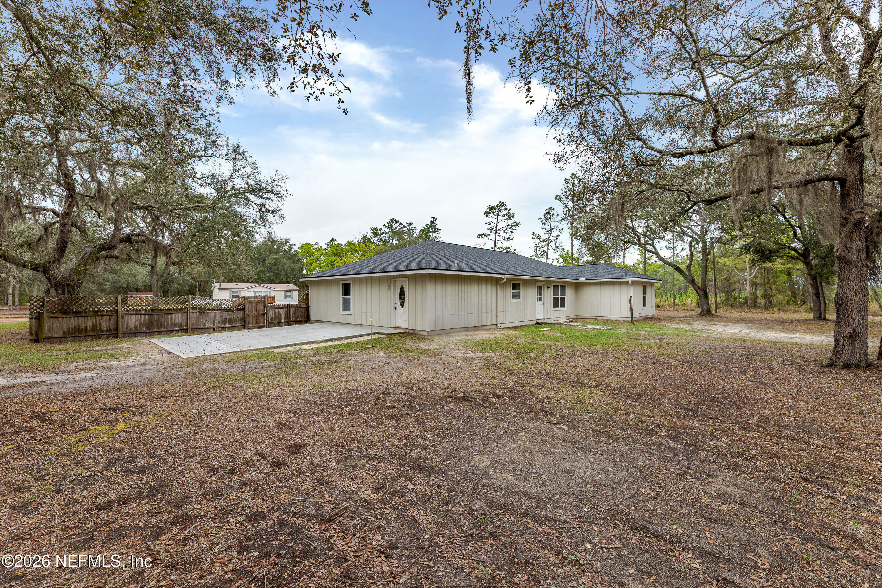 67104 Elnora Lane Yulee, FL 32097 - Photo 7 of 39 a view of a house with a yard