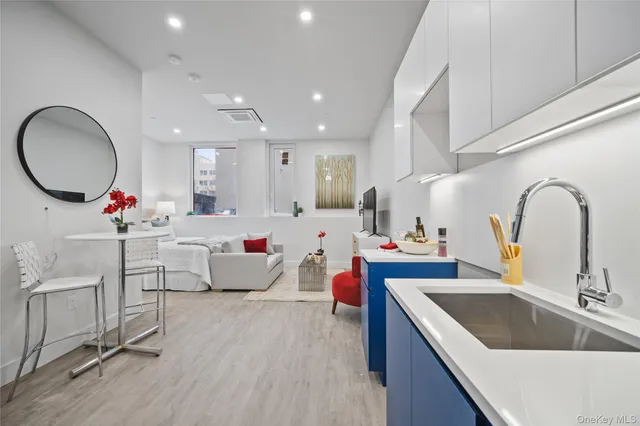 a bedroom with two beds and a couch