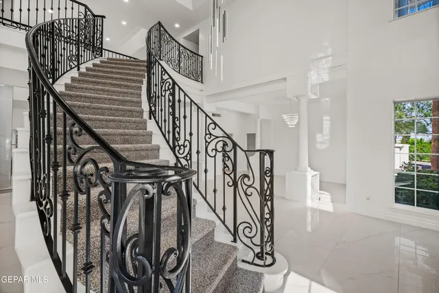 an empty room with fan and ceiling fan
