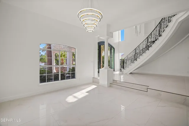 a bathroom with a granite countertop sink a toilet and a mirror