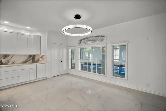 a bathroom with a double vanity sink mirror and shower