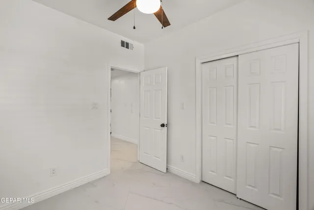 a view of a big yard with a house in the background