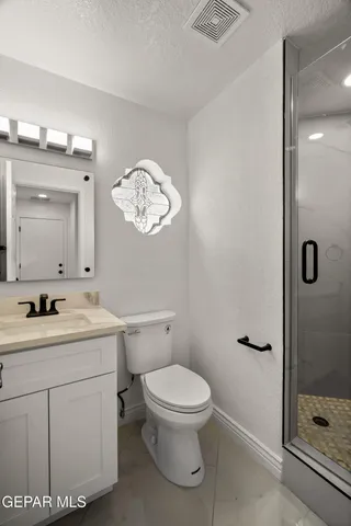 a front view of multi story residential apartment building with yard