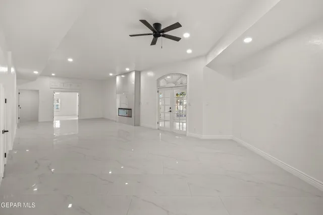 an aerial view of ocean and residential houses with outdoor space and ocean view