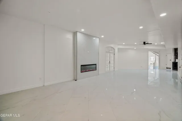 an aerial view of ocean beach and residential houses with outdoor space