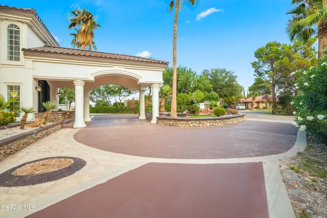a view of staircase with railing and a window