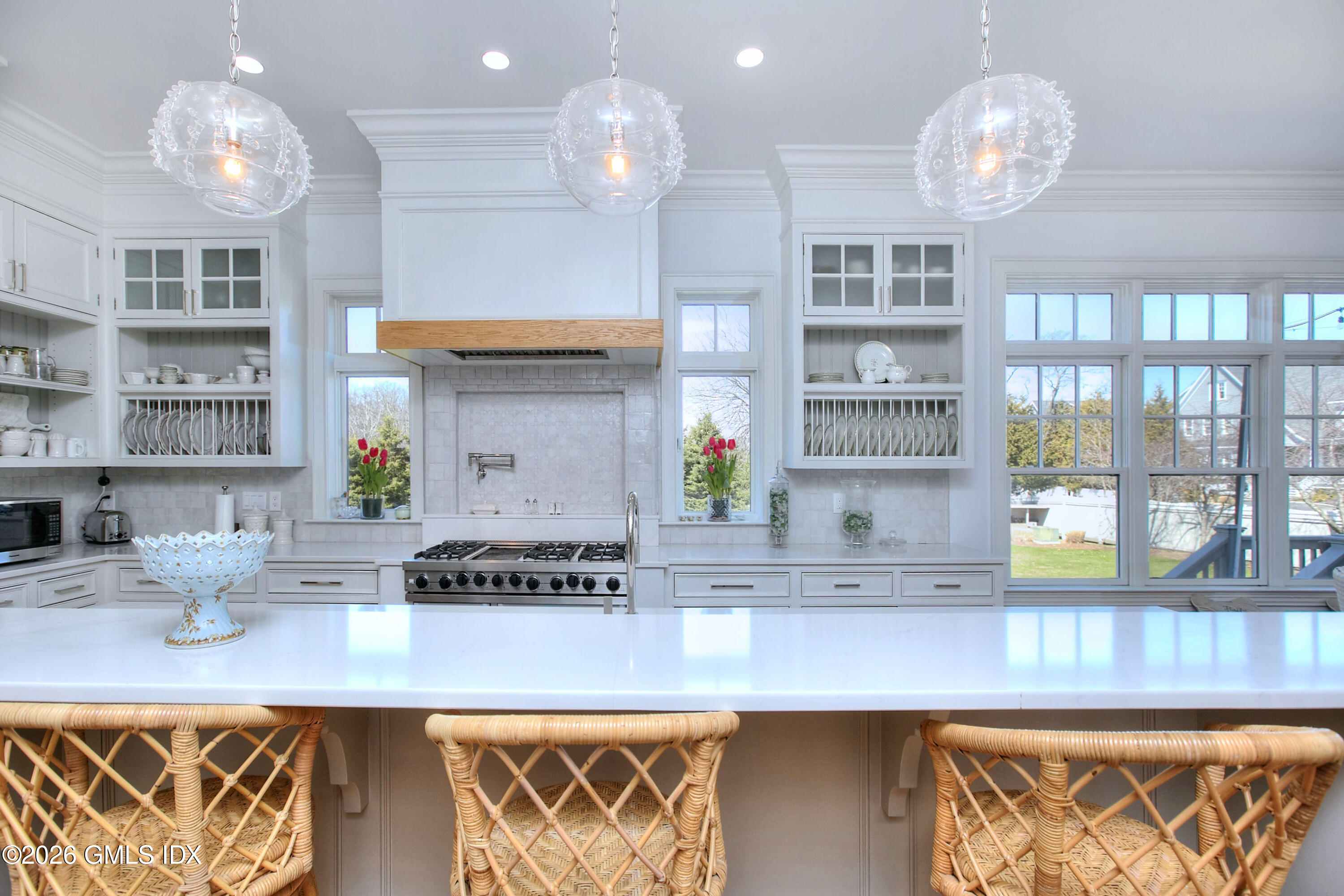 3 Shorehaven Road Norwalk, CT 06855 - Photo 13 of 40 a kitchen with stainless steel appliances granite countertop a stove a sink and a chandelier