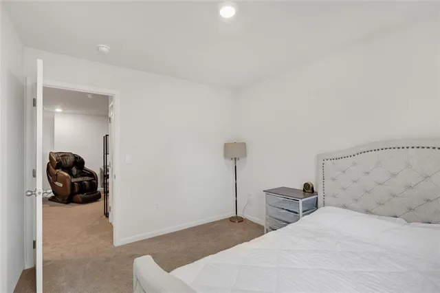 a bedroom with a bed and a couch