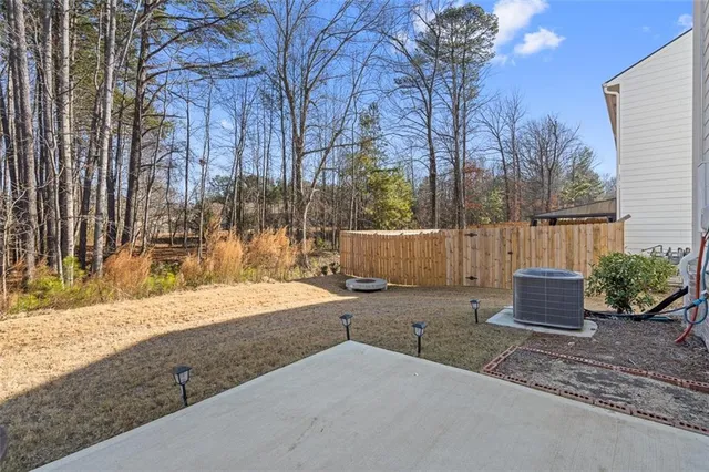 a backyard of a house with lots of green space