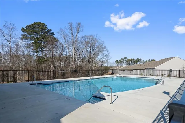 a view of a swimming pool with a patio