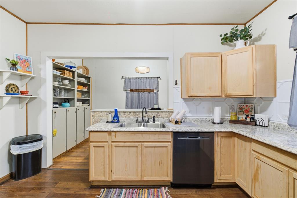 902 North Travis Street De Leon, TX 76444 - Photo 23 of 34 a kitchen with a sink stove and cabinets