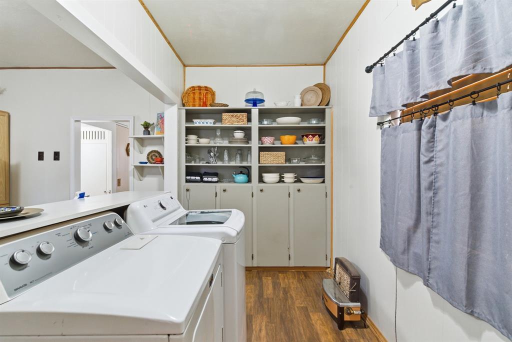 902 North Travis Street De Leon, TX 76444 - Photo 29 of 34 a view of walk in closet with clothes and shoes