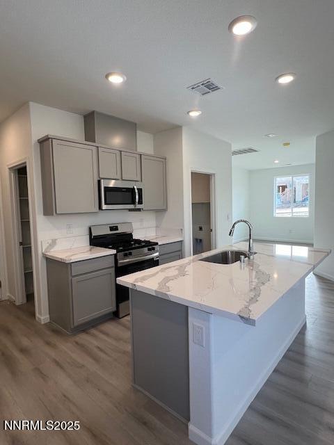 760 Kess Way, Unit LOT 86 Reno, NV 89506 - Photo 8 of 14 a large kitchen with stainless steel appliances granite countertop a sink a stove a refrigerator counter space and cabinets