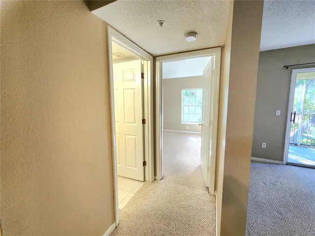 a bathroom with a granite countertop sink toilet mirror and shower