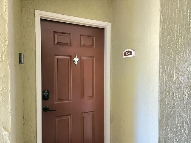 a kitchen with granite countertop a sink a stove and cabinets