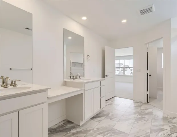 a bathroom with a sink a mirror and a bathtub