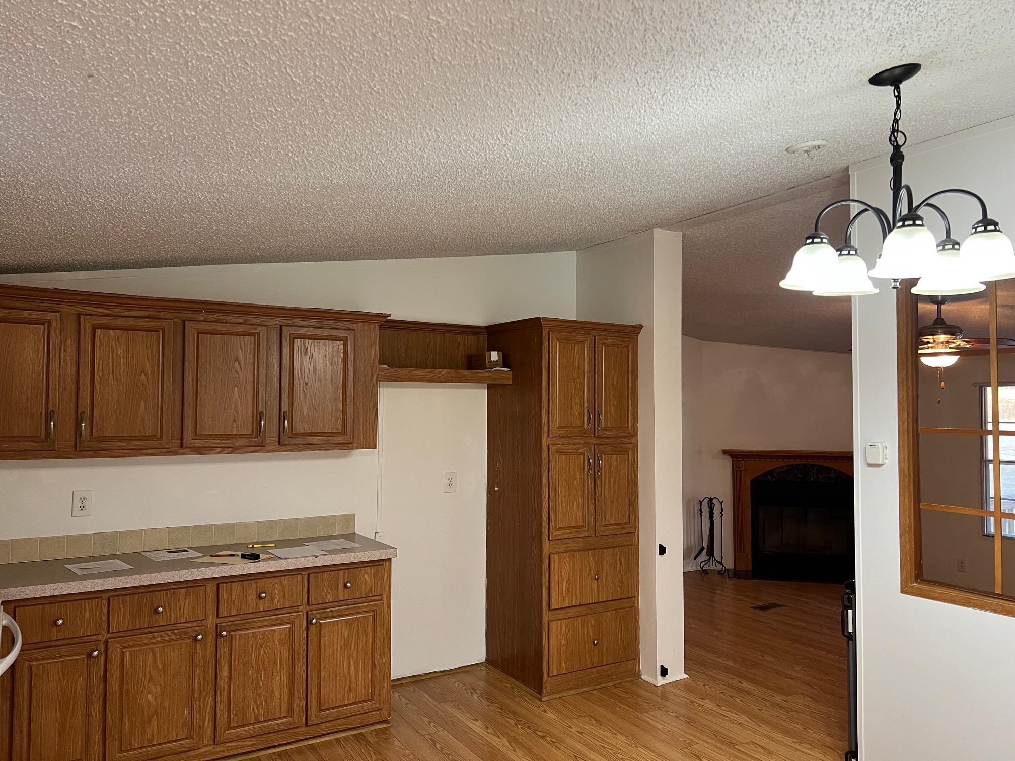 2274 Culps Bend Road Clifton, TN 38425 - Photo 2 of 22 a kitchen with a refrigerator and cabinets