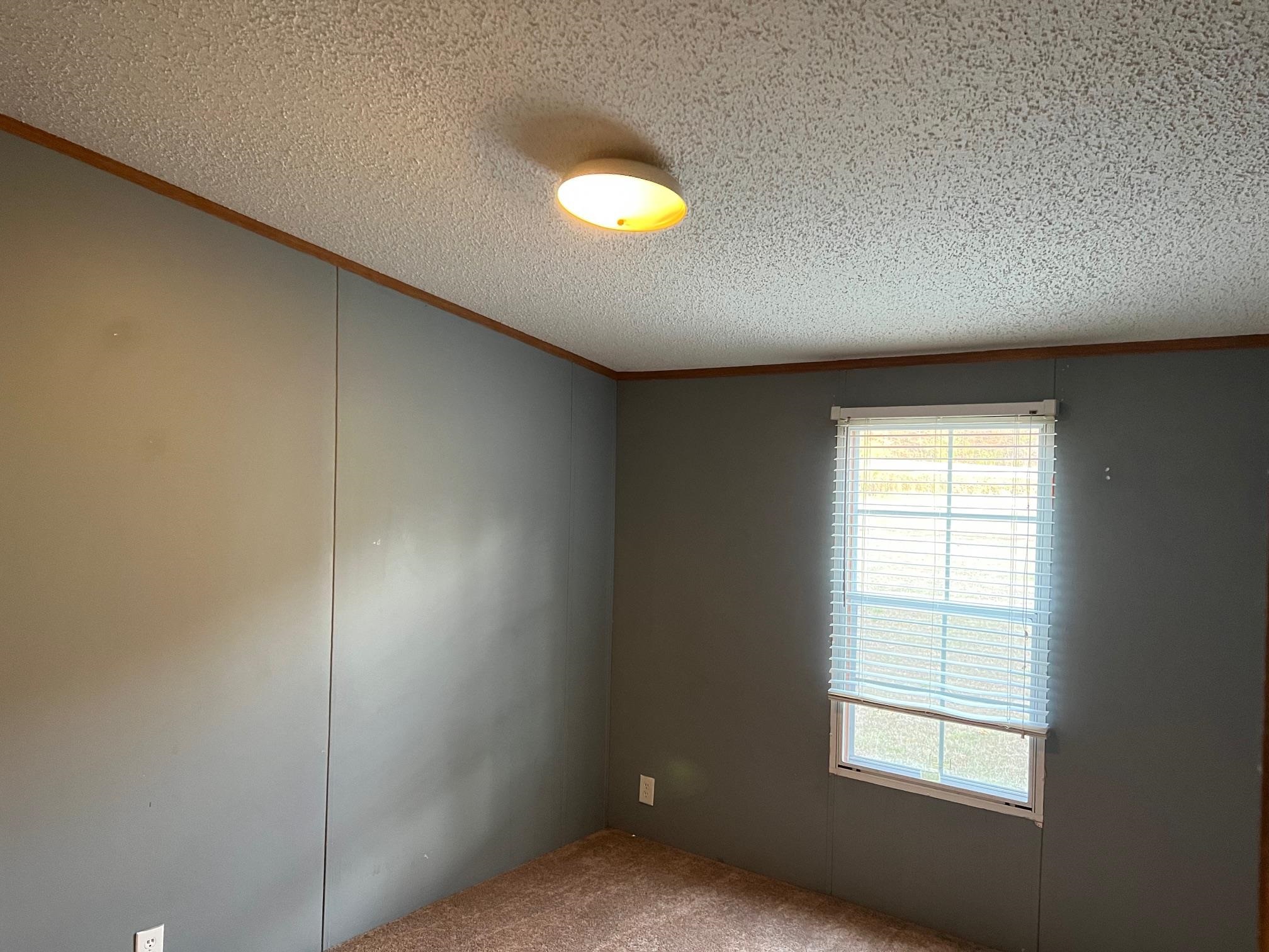 2274 Culps Bend Road Clifton, TN 38425 - Photo 8 of 22 a view of an empty room with a window