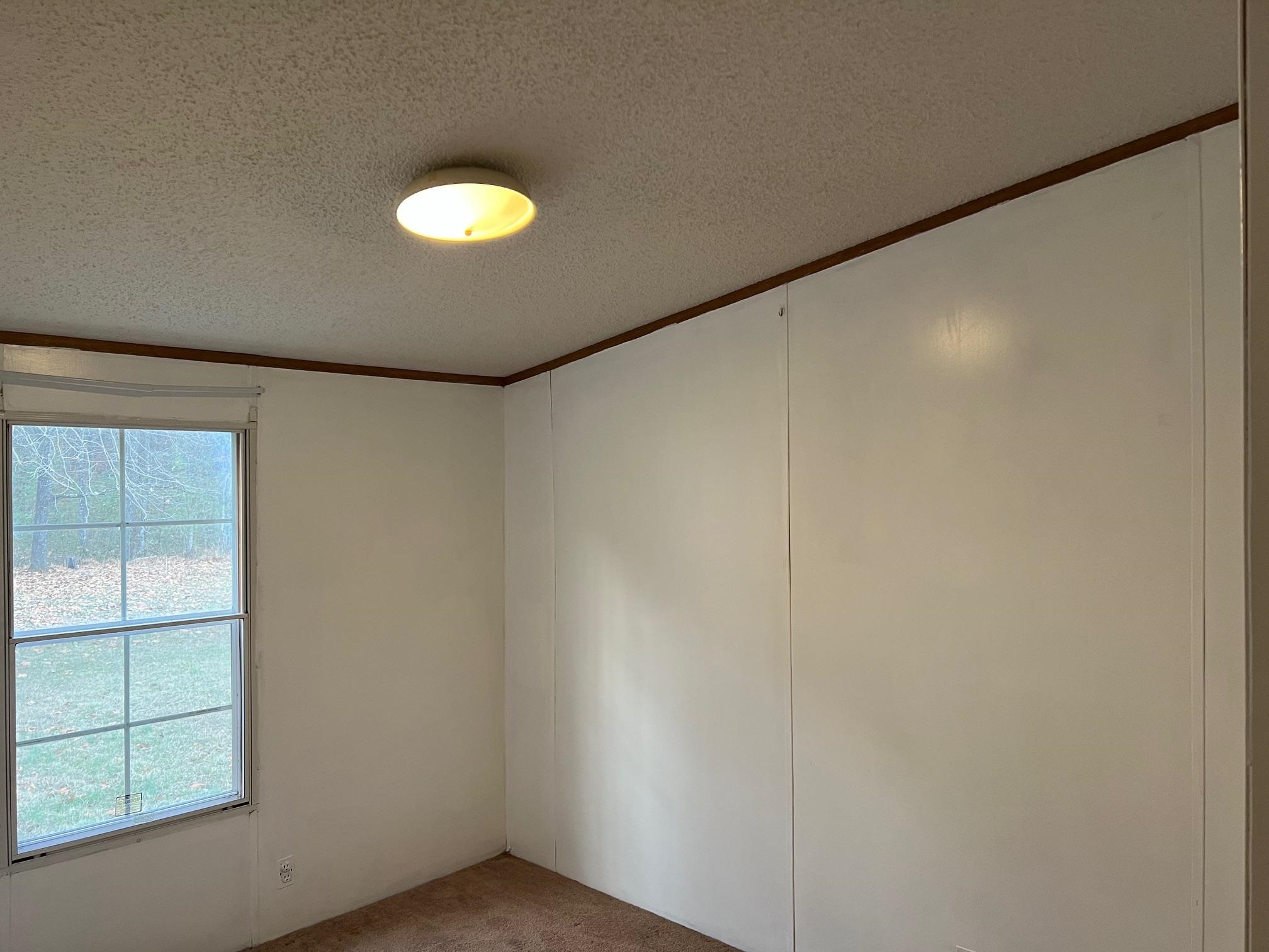 2274 Culps Bend Road Clifton, TN 38425 - Photo 9 of 22 a view of an empty room with a window