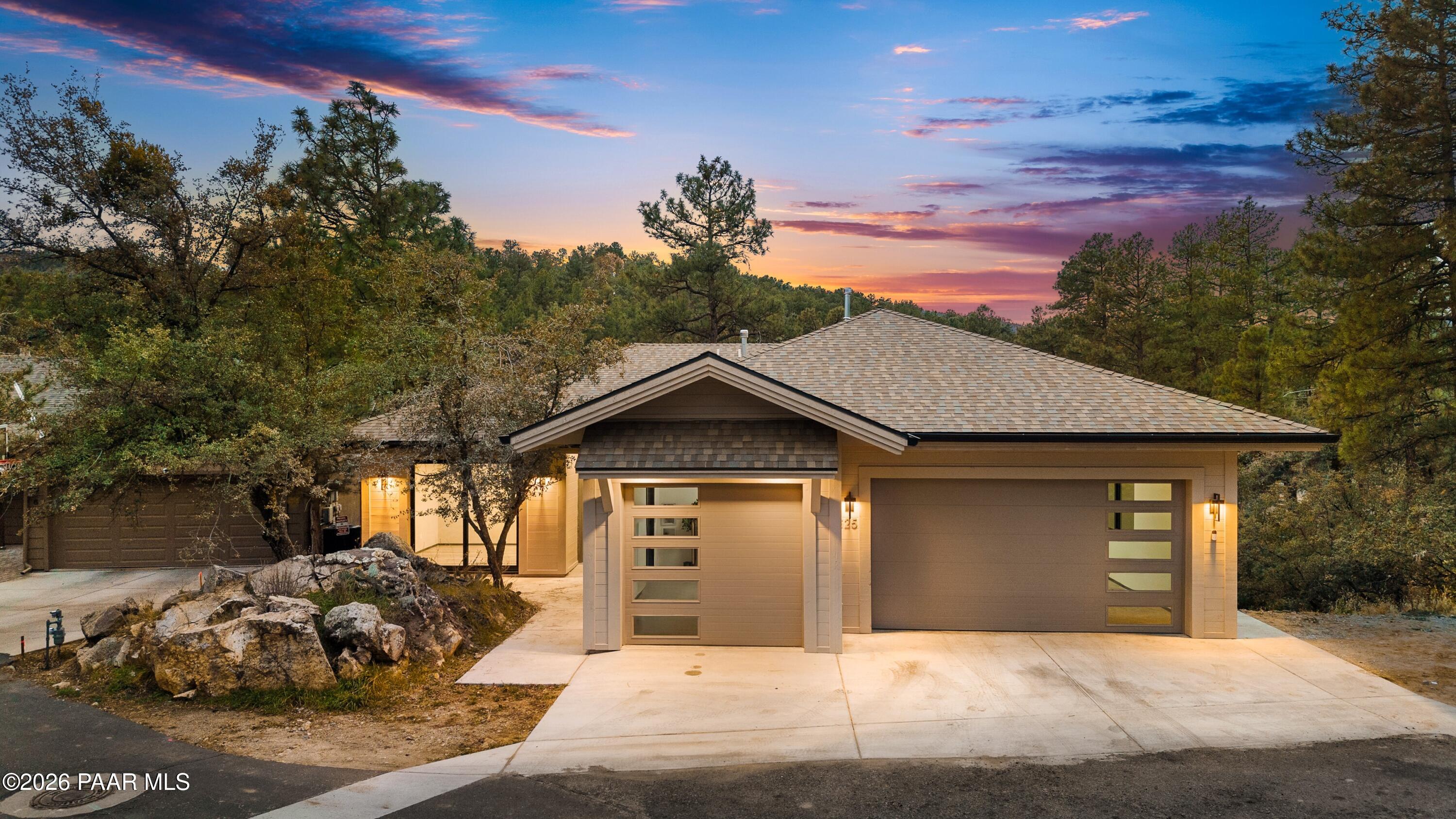 625 Aspen Way Prescott, AZ 86303 - Photo 1 of 48 a front view of a house with a yard and garage