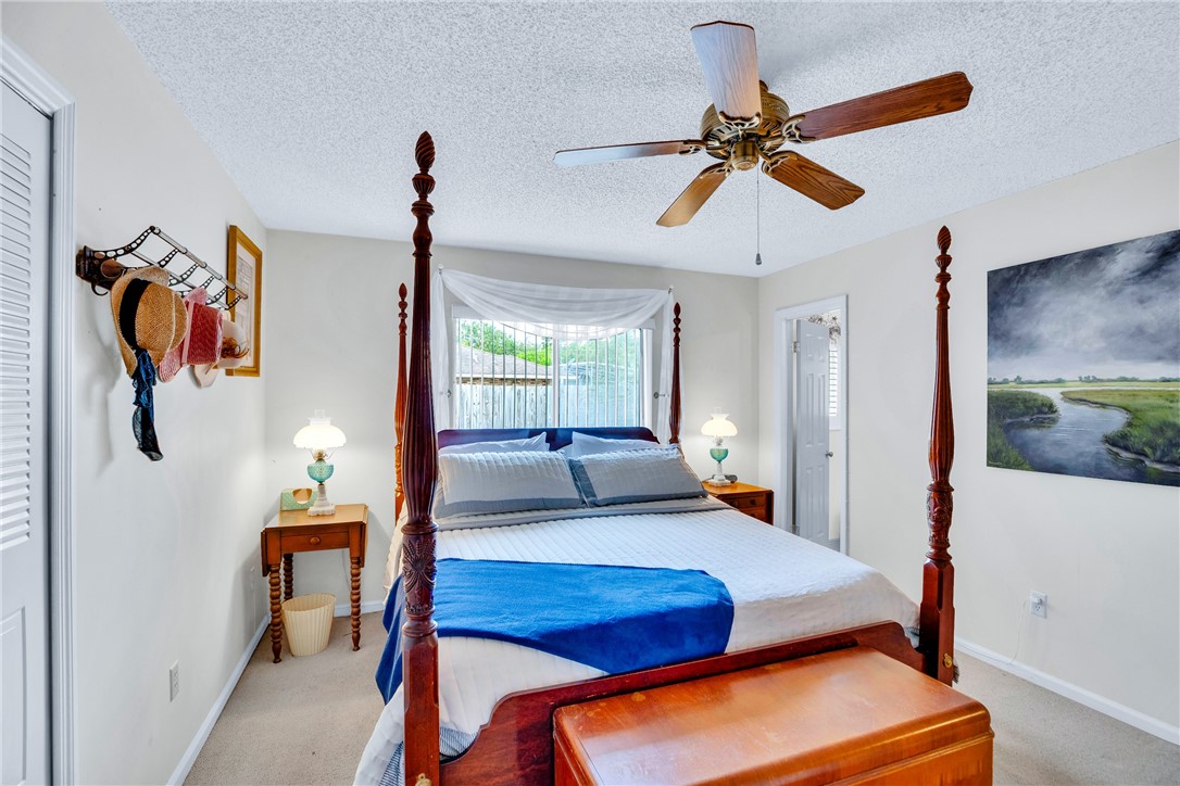 7666 134th Street Sebastian, FL 32958 - Photo 16 of 35 a living room with furniture and a chandelier