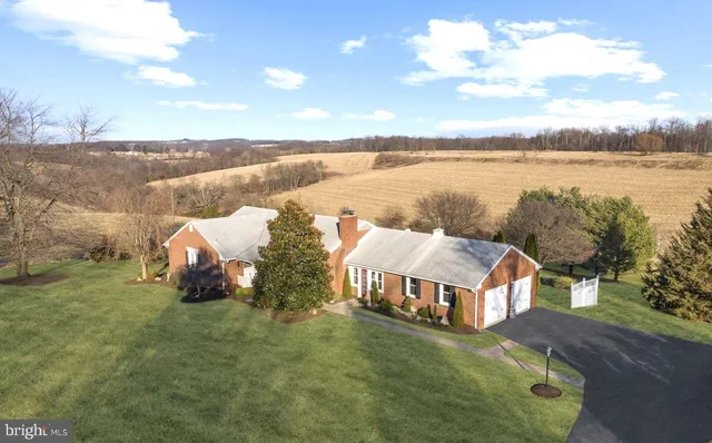 a view of a lake with a houses in the background