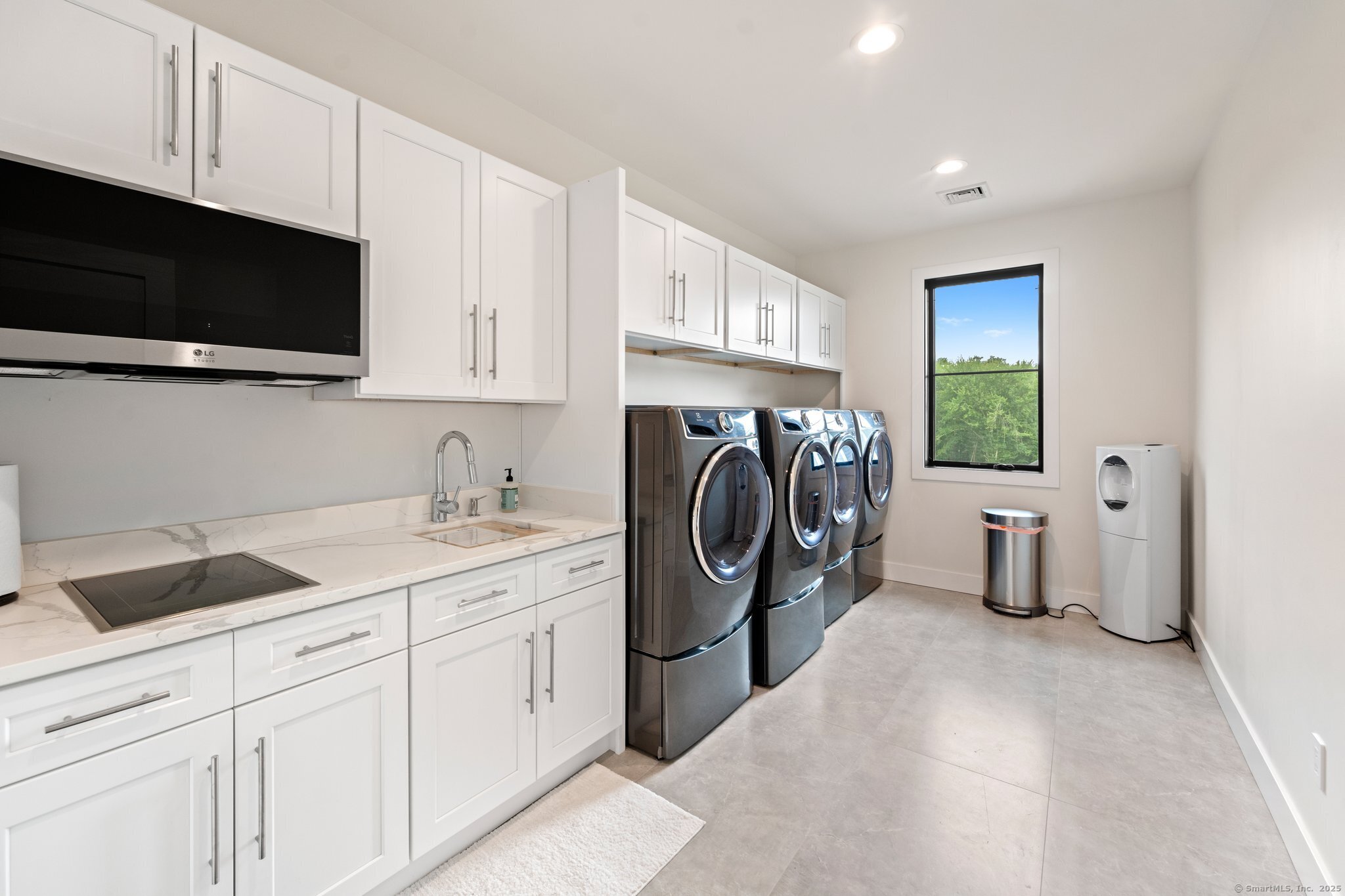 Undisclosed Address Norwich, CT 06360 - Photo 15 of 40 a kitchen with a sink a washer and dryer