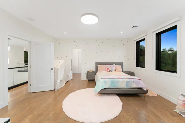 a bedroom with a bed and a couch