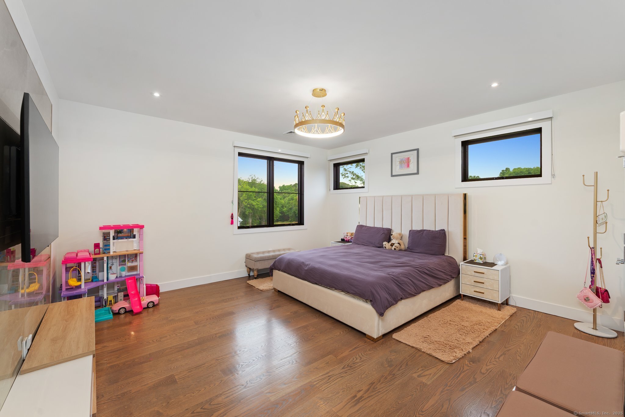 Undisclosed Address Norwich, CT 06360 - Photo 20 of 40 a bedroom with a bed and a wooden floor