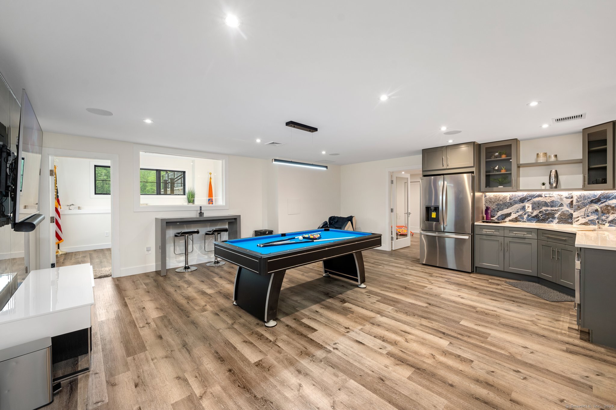 Undisclosed Address Norwich, CT 06360 - Photo 26 of 40 a kitchen with stainless steel appliances kitchen island granite countertop a refrigerator and a sink