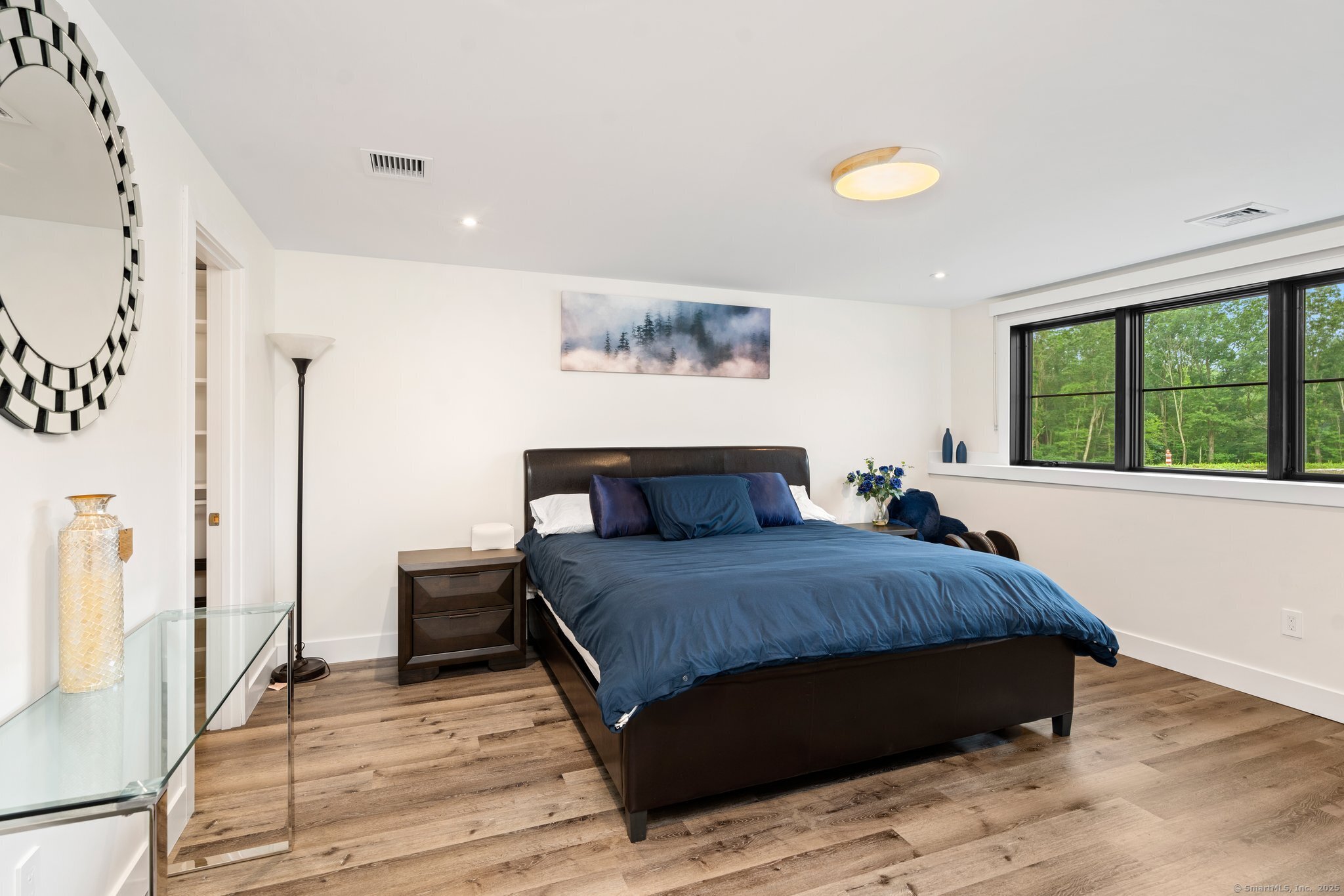 Undisclosed Address Norwich, CT 06360 - Photo 28 of 40 a living room with a bed furniture and a large window