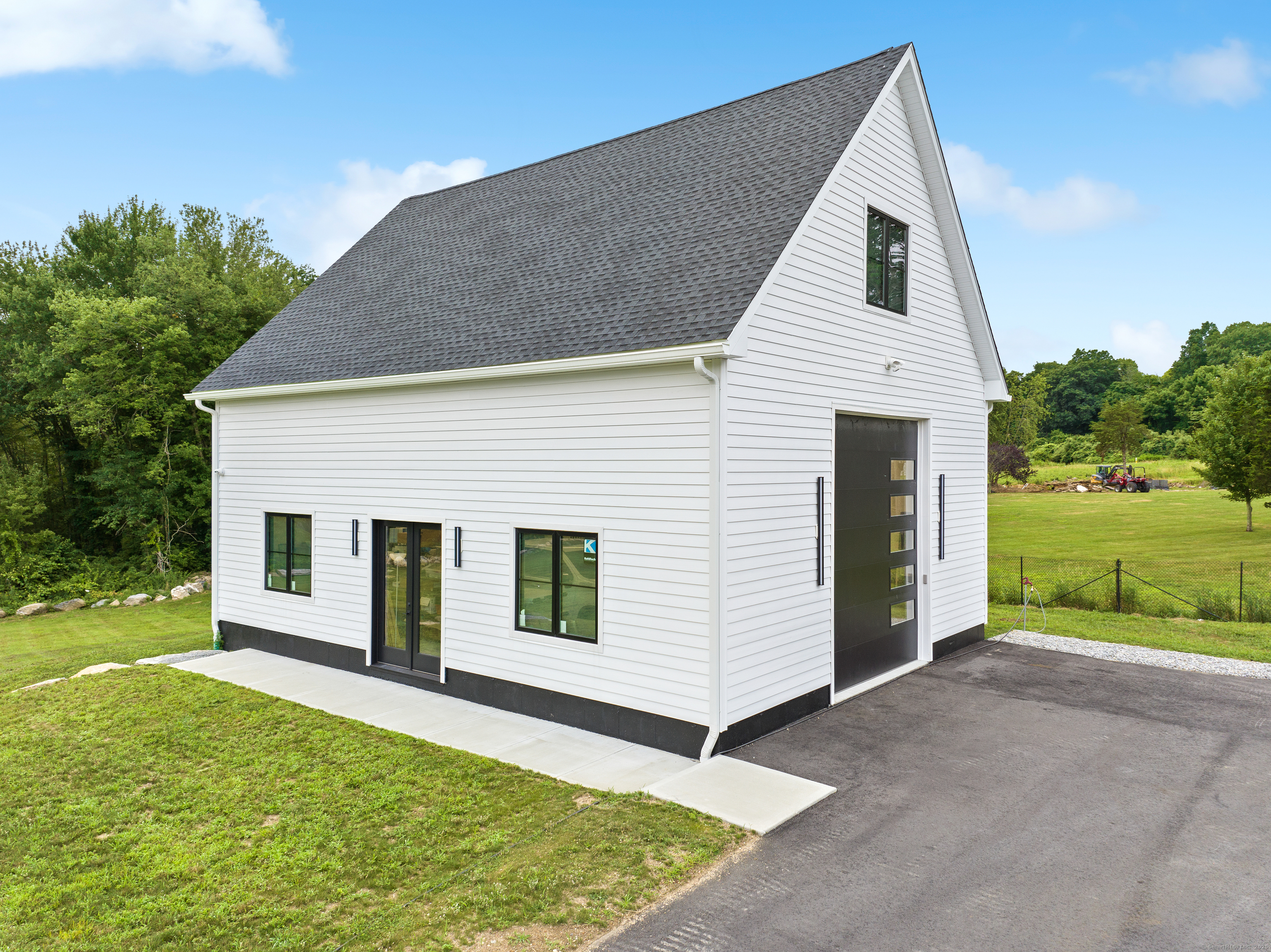 Undisclosed Address Norwich, CT 06360 - Photo 32 of 40 a view of a white house with a yard